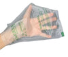 A hand holding a beyondGreen compostable poo bag