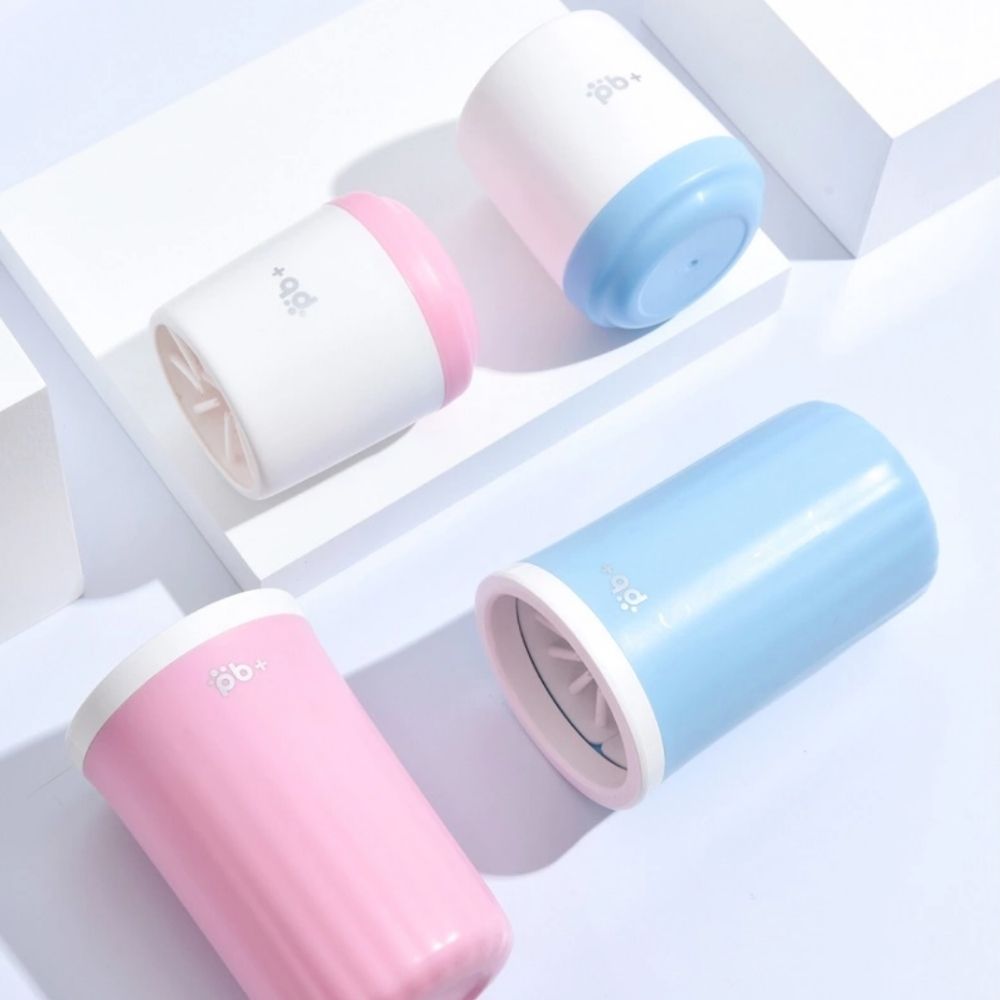 Potty Buddy paw cleaners laid out on a white surface